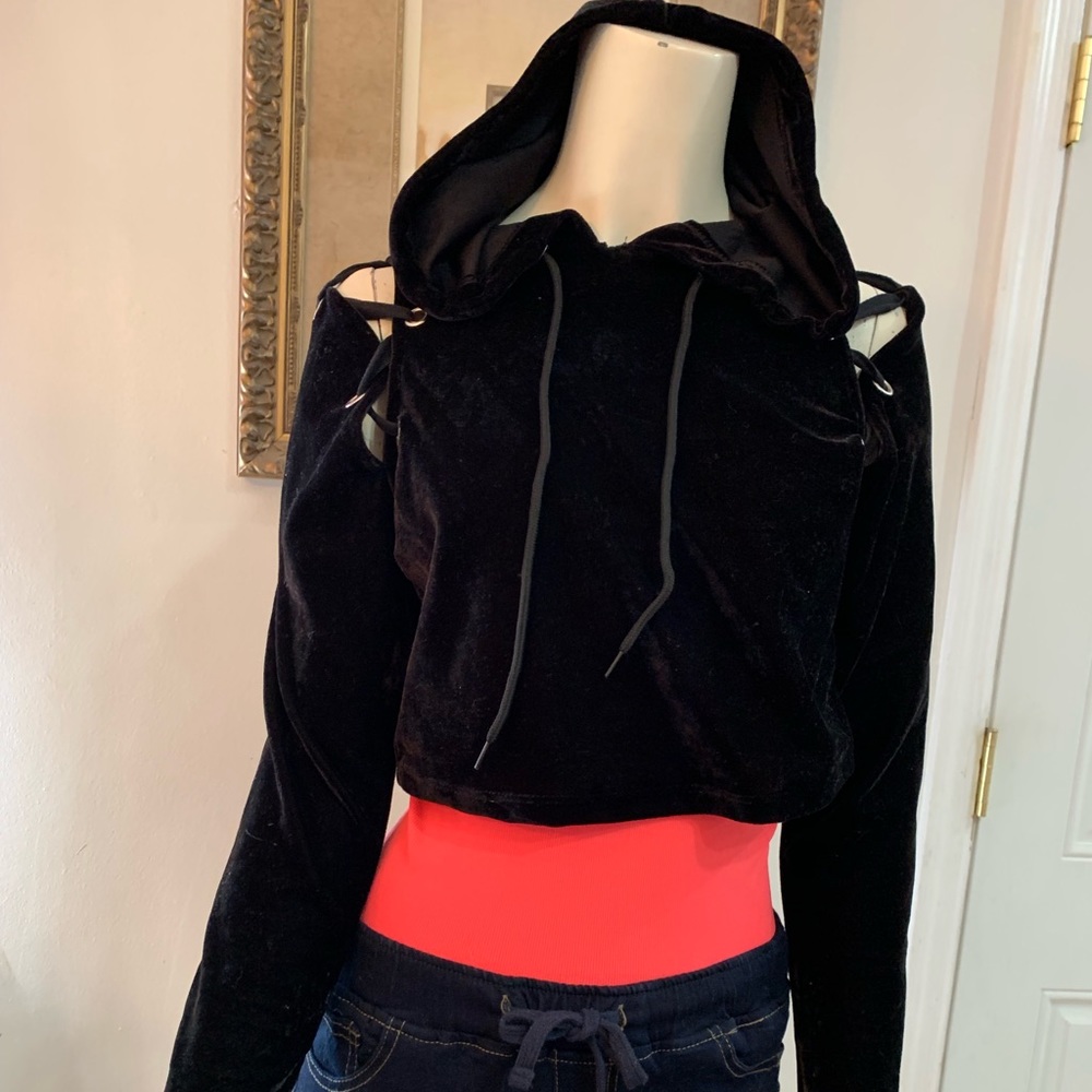 Black hooded sweatshirt with lace up shoulders.